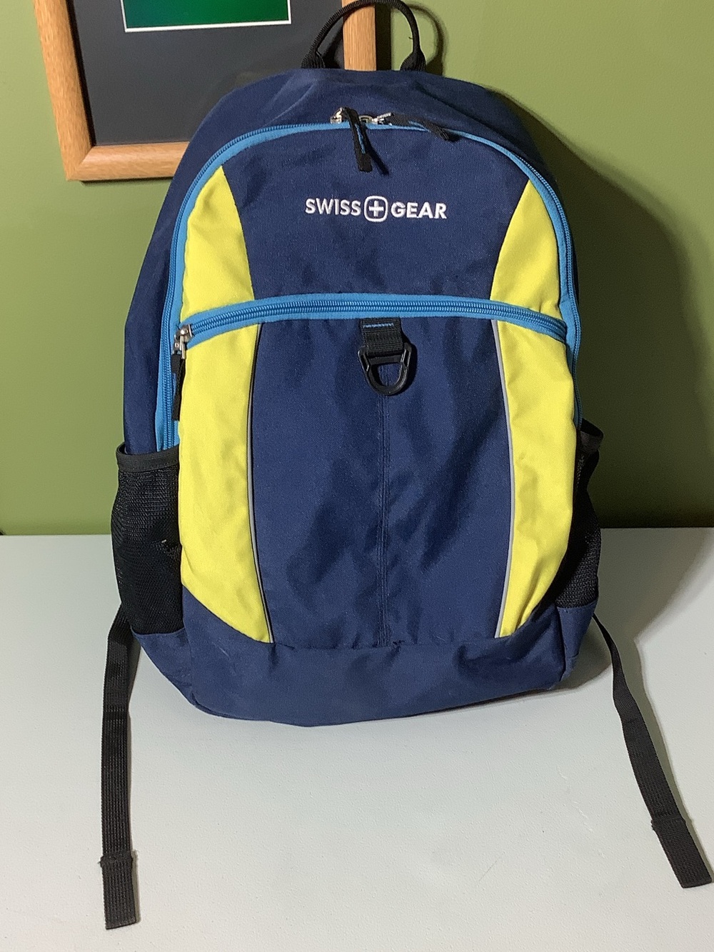 Swiss Gear navy, blue, yellow, and black backpack